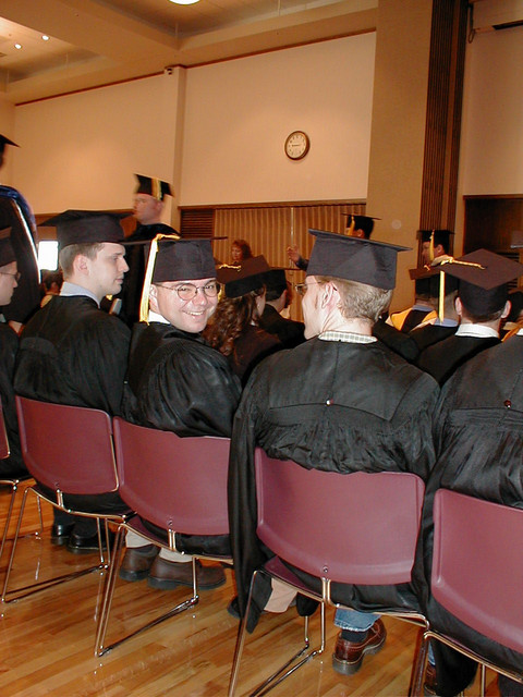 This is at Dan's graduation in Aug 2001.  We were lucky enough to sit in the front row of the audience section and he sat in the back row of the graduate section.  He looks happy to be done!