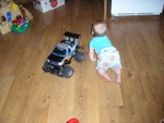 Who's bigger and/or faster -- Rhya or the remote control truck?