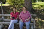 Shirley and Betsy sitting on a cement bench