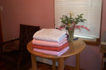 A few of the 50 quilts I'm sewing for the RS to tie, and flowers from the yard.