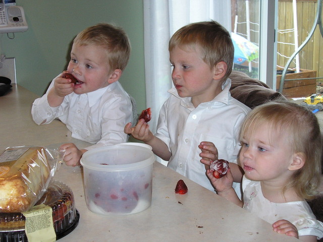 Aaron's family eating strawberries on Easter.
