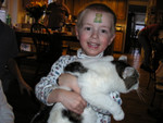 Paul at Kathie's house on Thanksgiving day 2004.  He liked tha kitty, but I think she was happy to be 'unsqueezed'!
