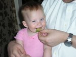Aaron giving Rhya a pickle and she's still smiling