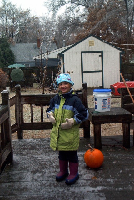 Ready to play outside.  The pumpkin was perfectly preserved for days in a half inch coating of ice.  As soon as the ice melted though, it mushed, flat as a pie!