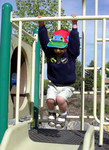 Paul's latest favorite thing to do at playgrounds is to hand on bars above slides and exclaim, "Monkey boy!"
