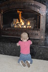 Rhya loves to watch the fire as Grandpa's house