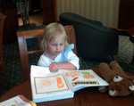 Dory in hotel great room working on her pre-school book