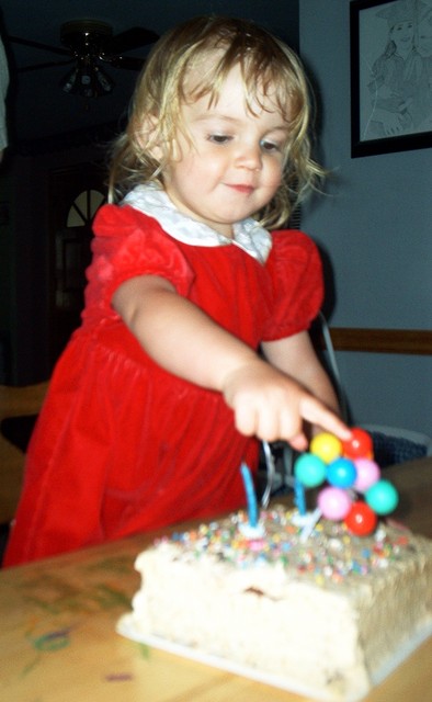 Sarah turned 2!  Birthday Cake with plastic Balloons.