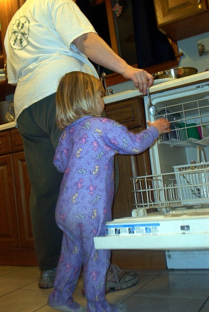 Sarah being helpful loading dishes