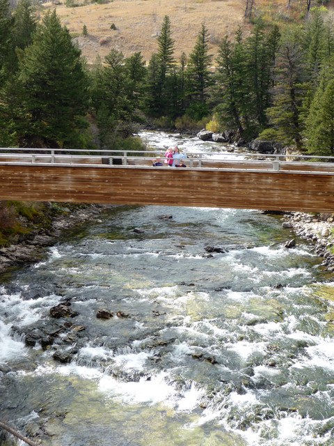A bridge across the Boulder River at Natural Bridge Falls, Montana